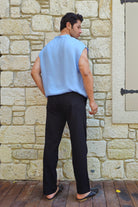 Modern men’s summer outfit featuring light blue sleeveless top